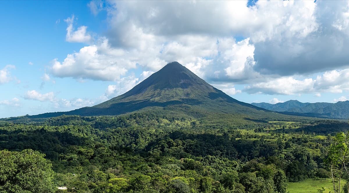 Arenal Volcano rising above forest in Costa Rica
